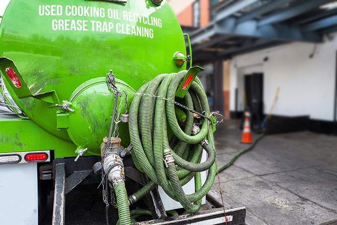 a service truck pumping grease from a restaurant's grease trap in Willowbrook IL